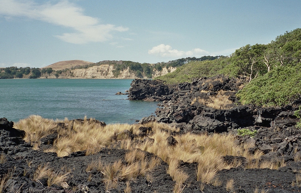 Lava beach on Rangitoto Island with Motutapu Island