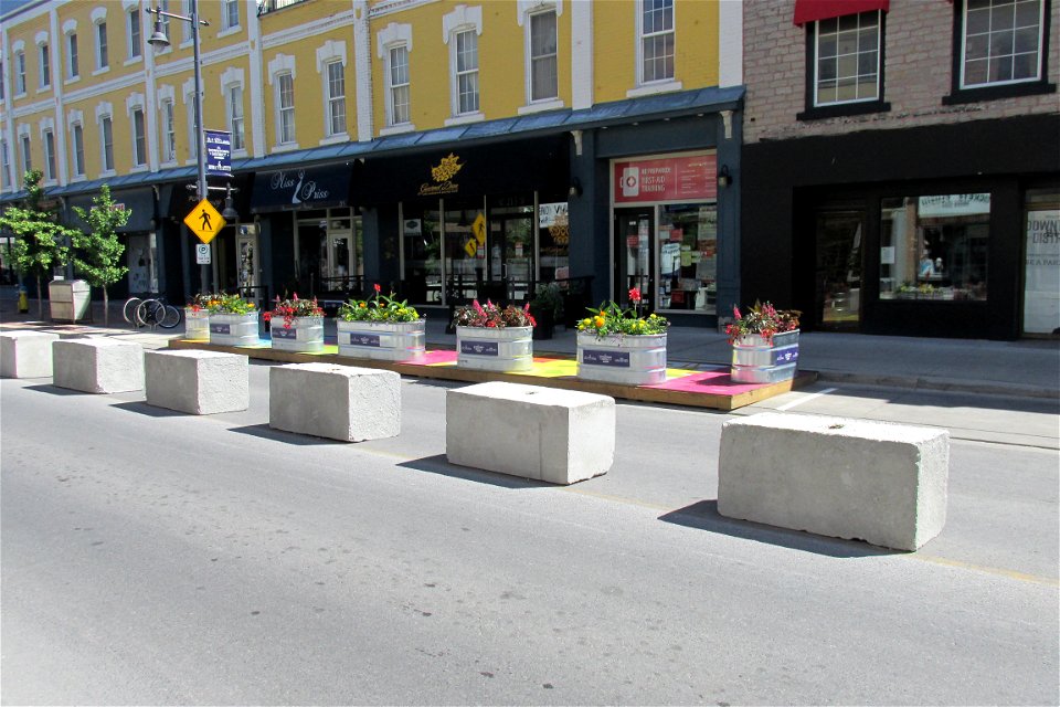 Sidewalk extension with flowers added.
