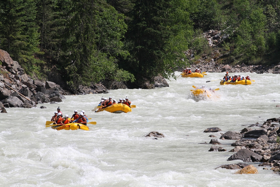 Group of adventurers in an inflatable dinghy in the white water
