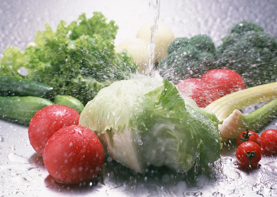 Fresh tomato and green fresh salad with water drop splash