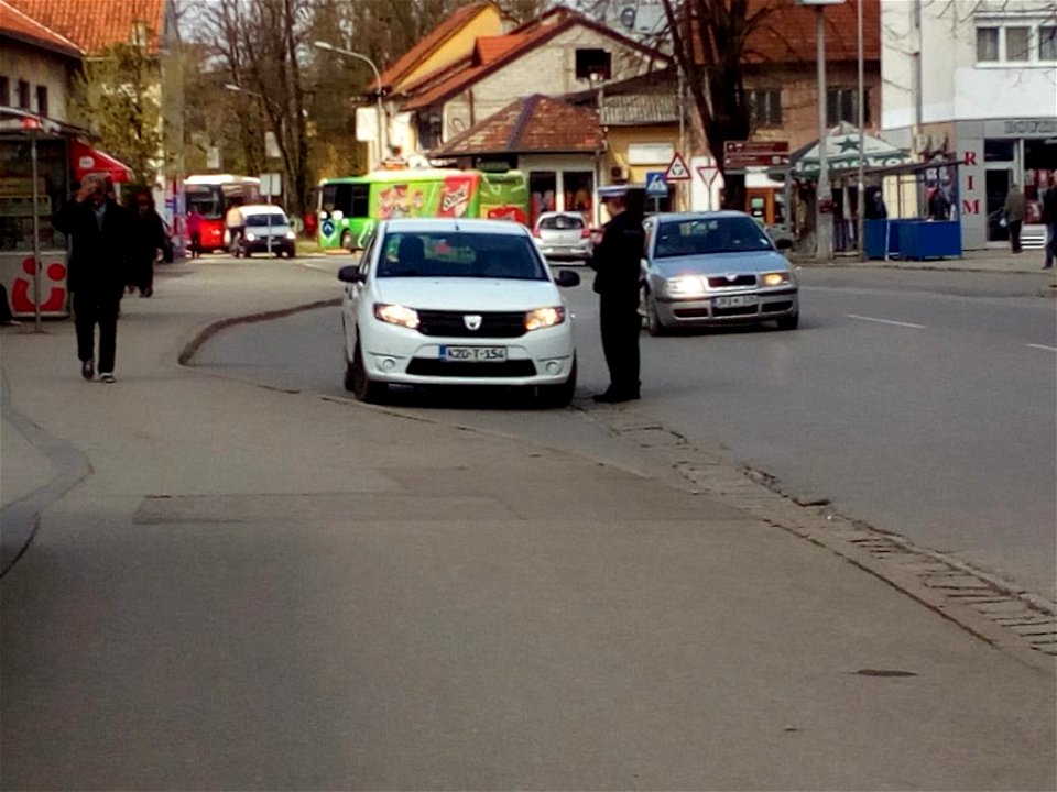 Policeman punishes driver because of prohibited parking on bus stop, Banja Luka, Bosnia and Herzegovina