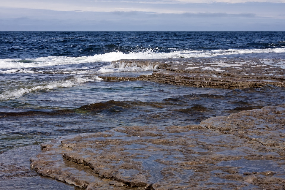 rock and splashing waves in sea