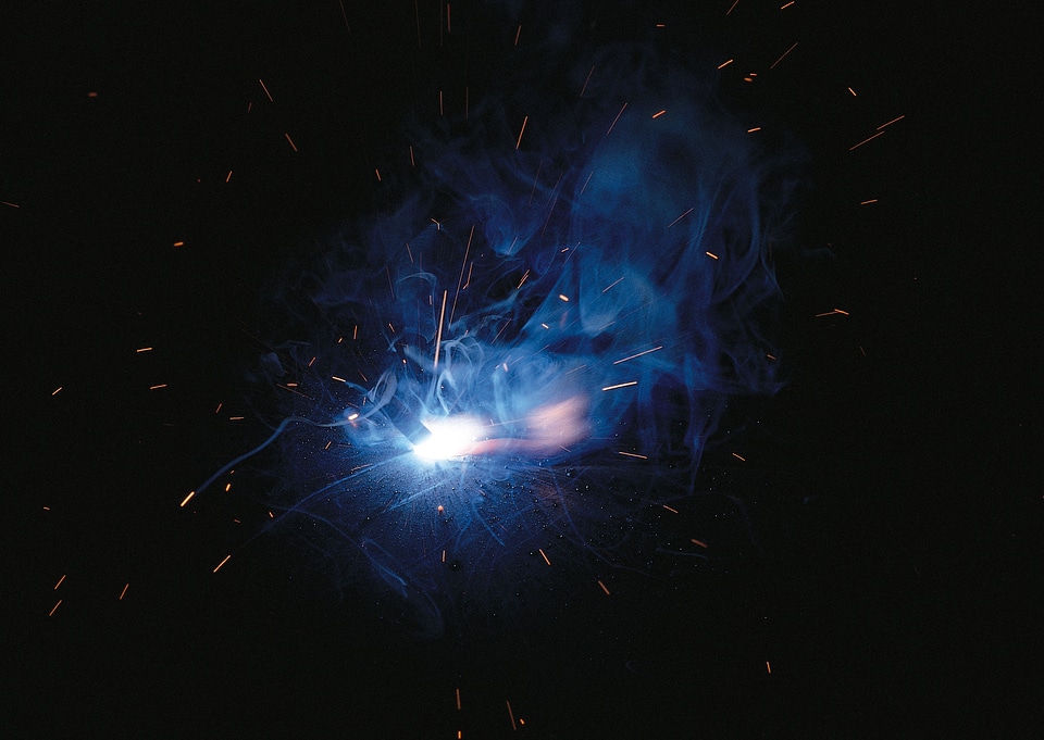 Sparks during metal cutting over black
