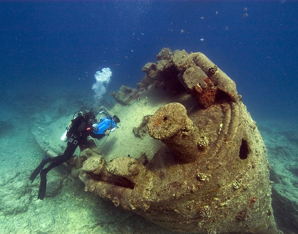 diver inspecting the remains of the USS MACAW photo