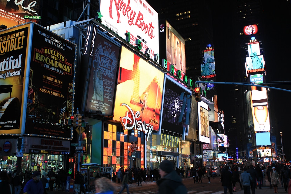 Illuminated facades of Broadway theaters in Times Square, NYC