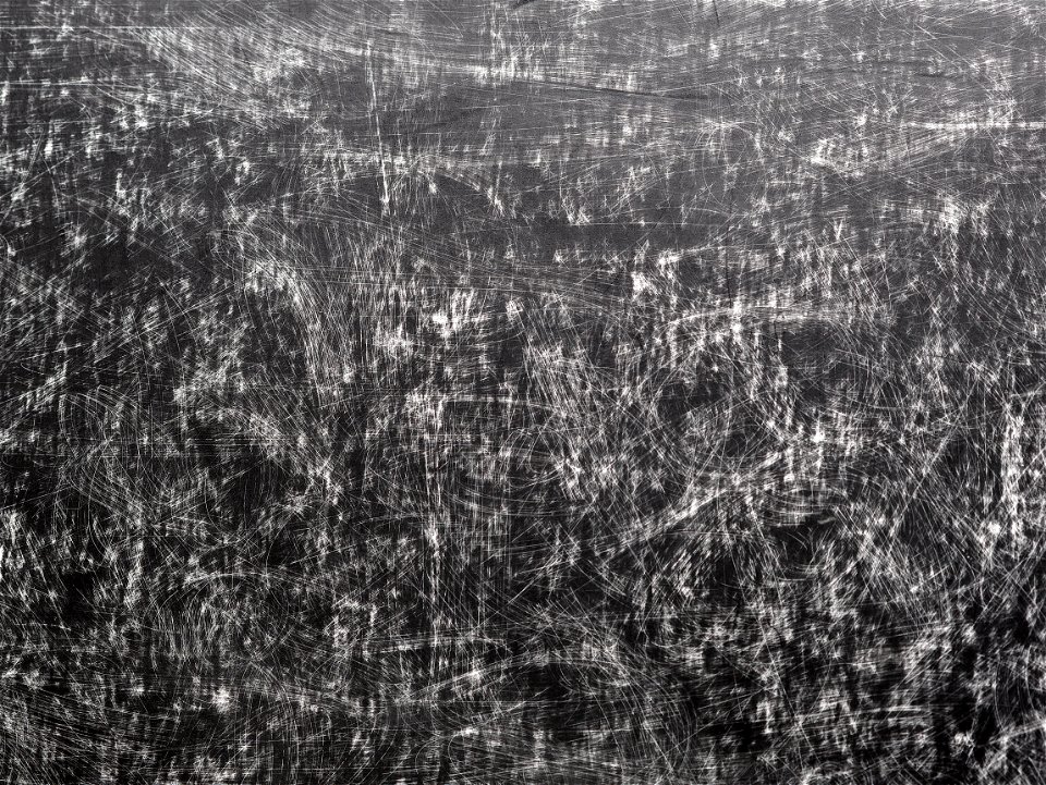 white cardboard painted black with scratches