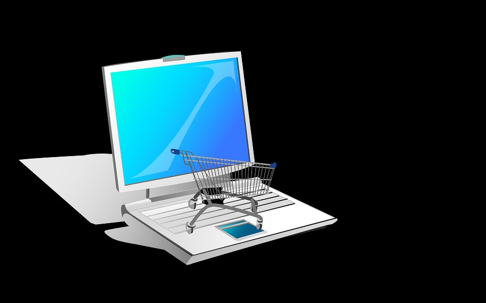 Shopping-cart over a laptop