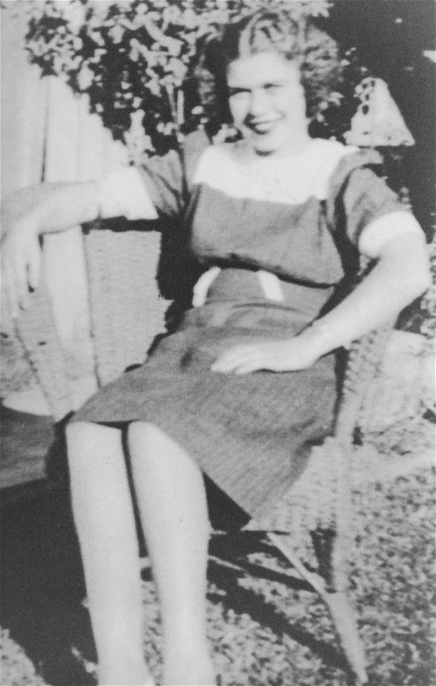 Young lady seated outside