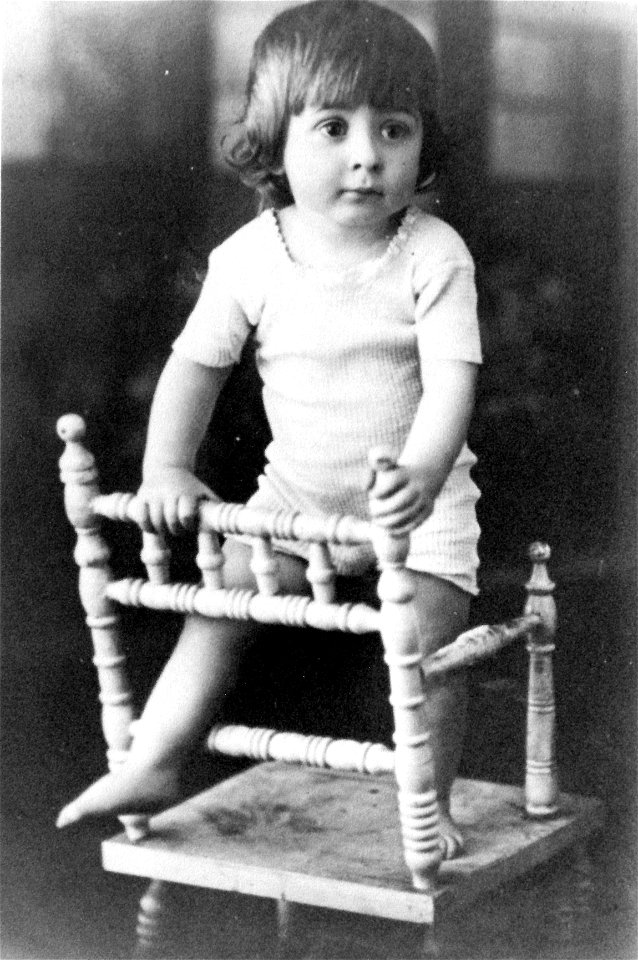 Studio portrait of a very young Bertie Melvin Foster, standing on a high chair [n.d.]