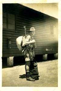 Soldier packed and ready outside barracks, probably in either Darwin or PNG.