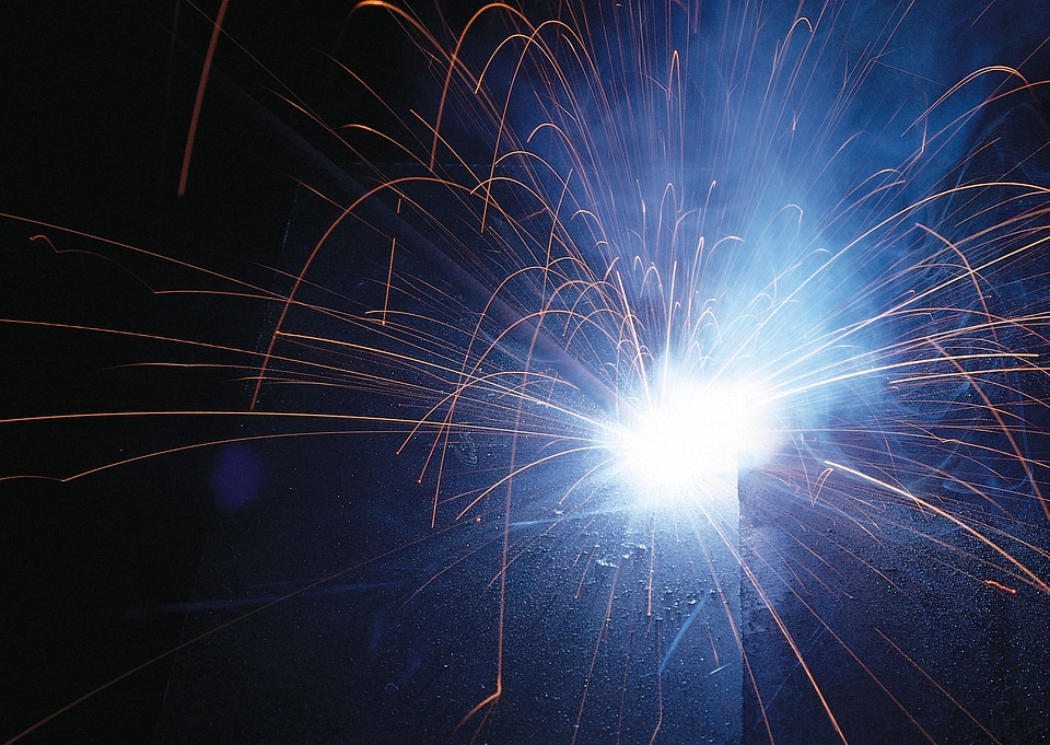 Sparks during metal cutting over black
