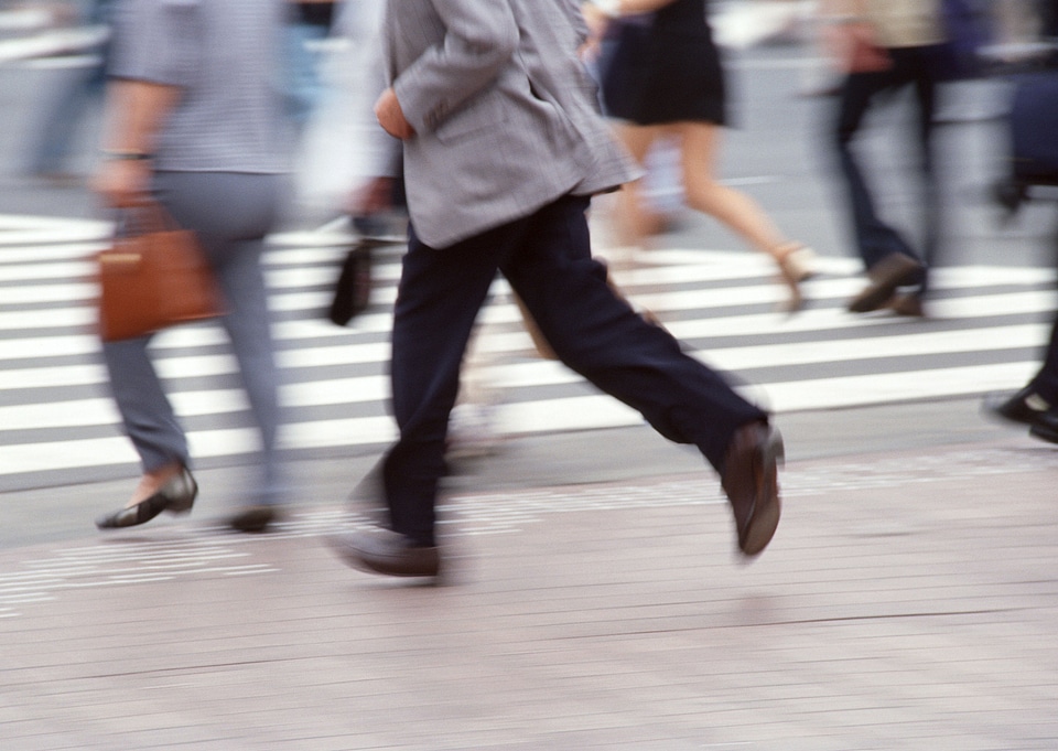 Unidentified businessmen crossing the street