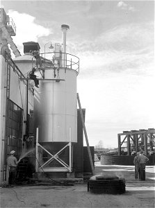 Historic photo of Wood pulp paper plant at Longview affords employment for many of the homesteaders. Washington, Cowlitz County