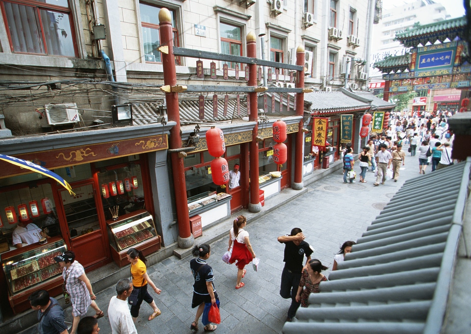 Busy back street filled with people near Chien Men