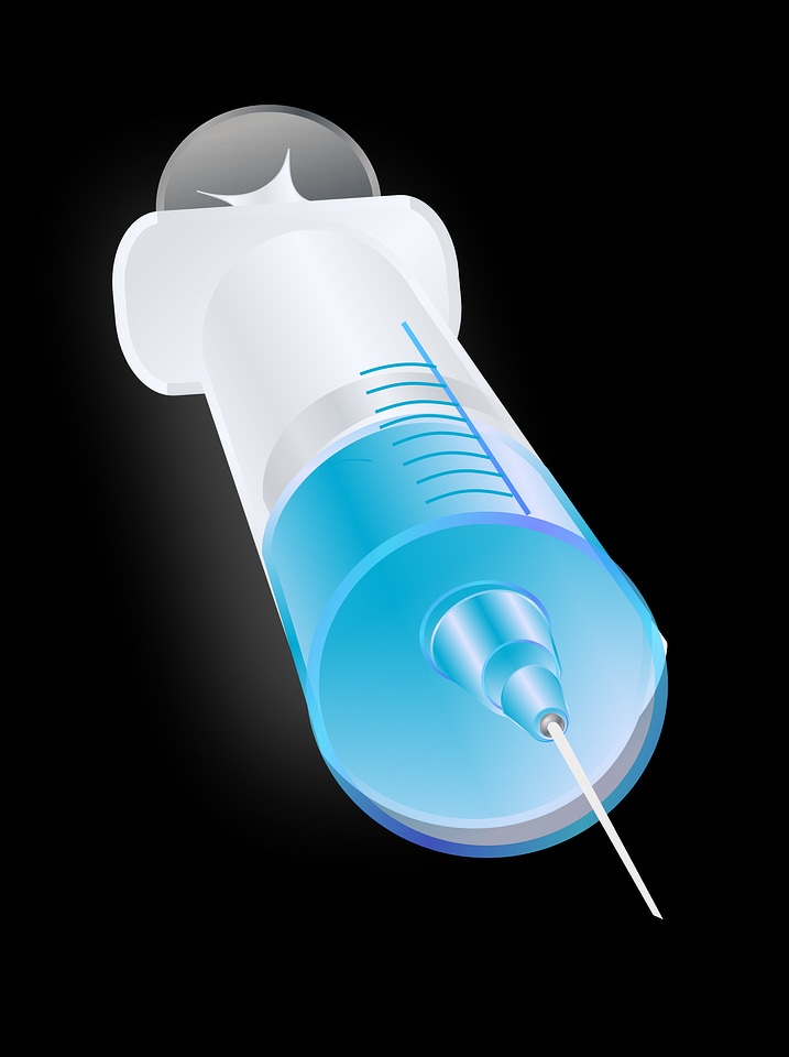 Big empty syringe isolated on white