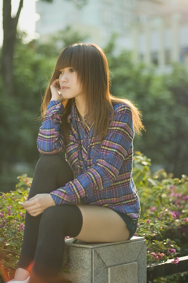 A Beautiful Korean Girl Posing Outdoors
