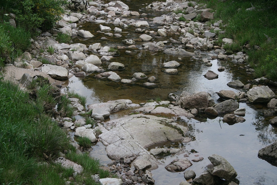 brown natural wet rocks in river water background