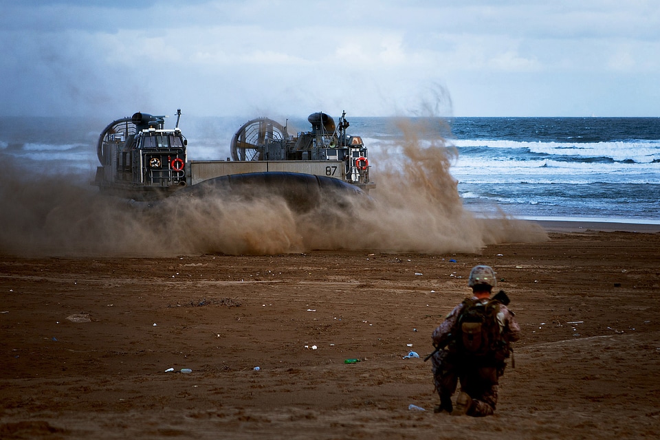 US Navy hovercraft carries vehicles and Marines