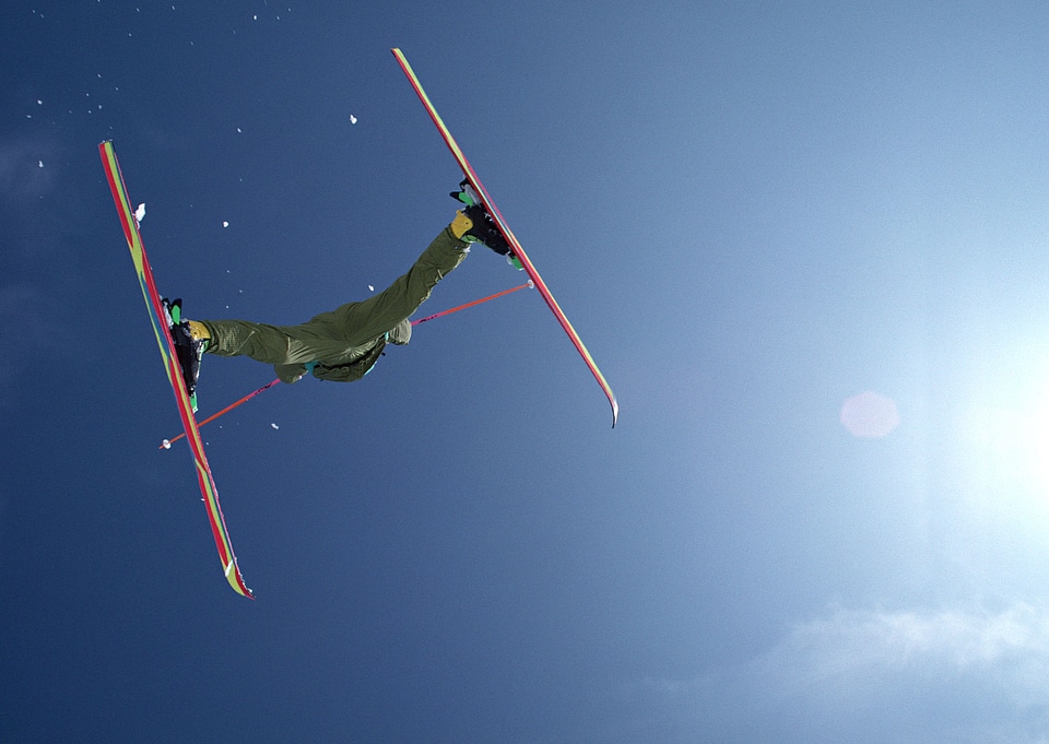 Jumping Skier in high mountains
