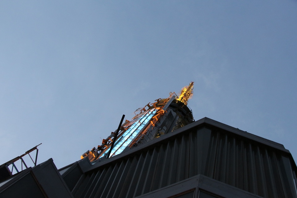 Top of Empire State Building in the night with metal antenna