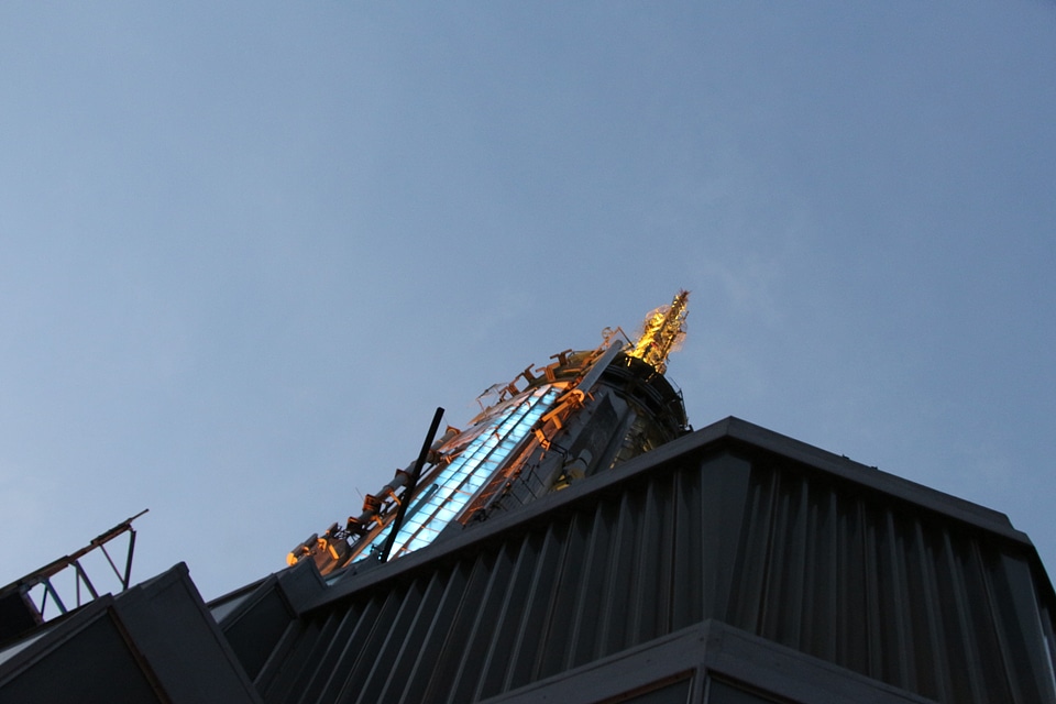 Top of Empire State Building in the night with metal antenna photo