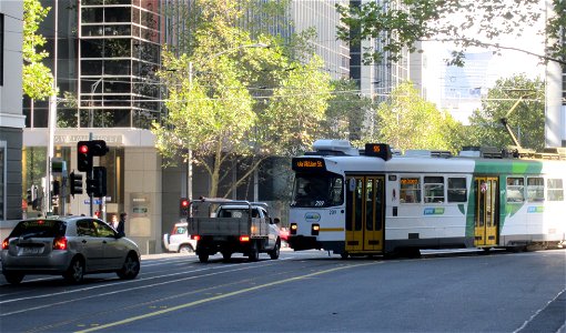 The car backs into the correct lane, and the tram continues on