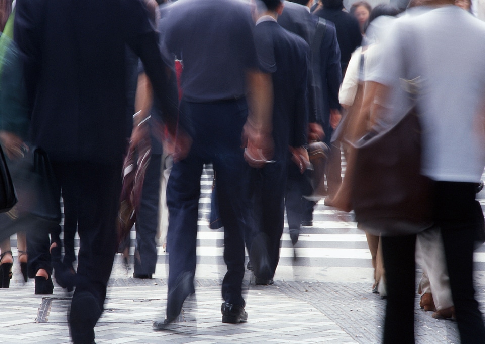 Unidentified businessmen crossing the street
