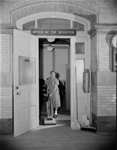 Washington, D.C. Charwoman cleaning after regular working hours at the Office of the Registrar of the Treasury