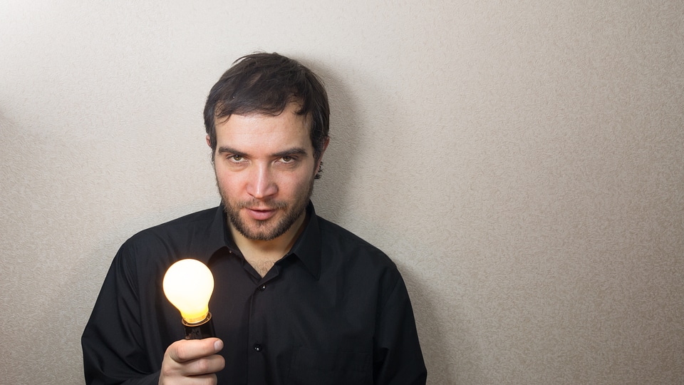 Man holding light bulb photo