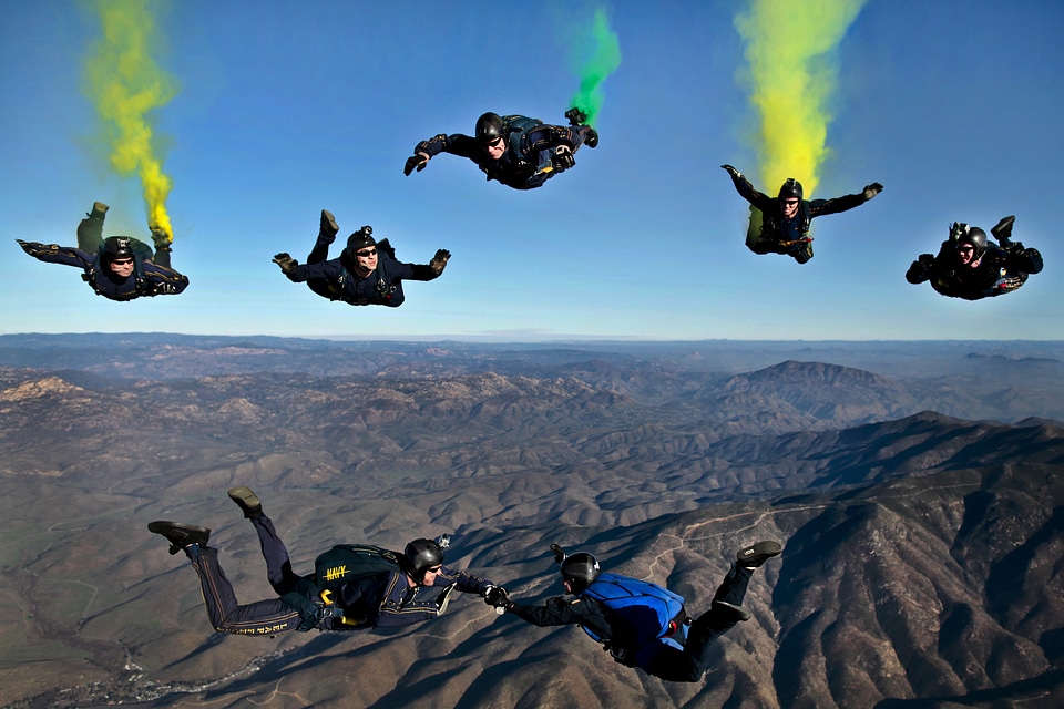 Skydivers parachutists jump out of an airplane photo