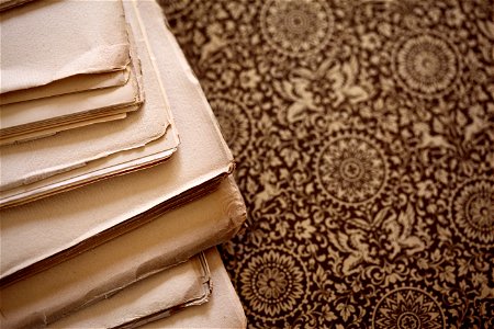 Stack of Old Yellowed Paper Background photo
