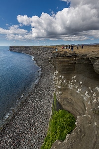 rocky cliff overlooking the sea in Vik in Iceland photo