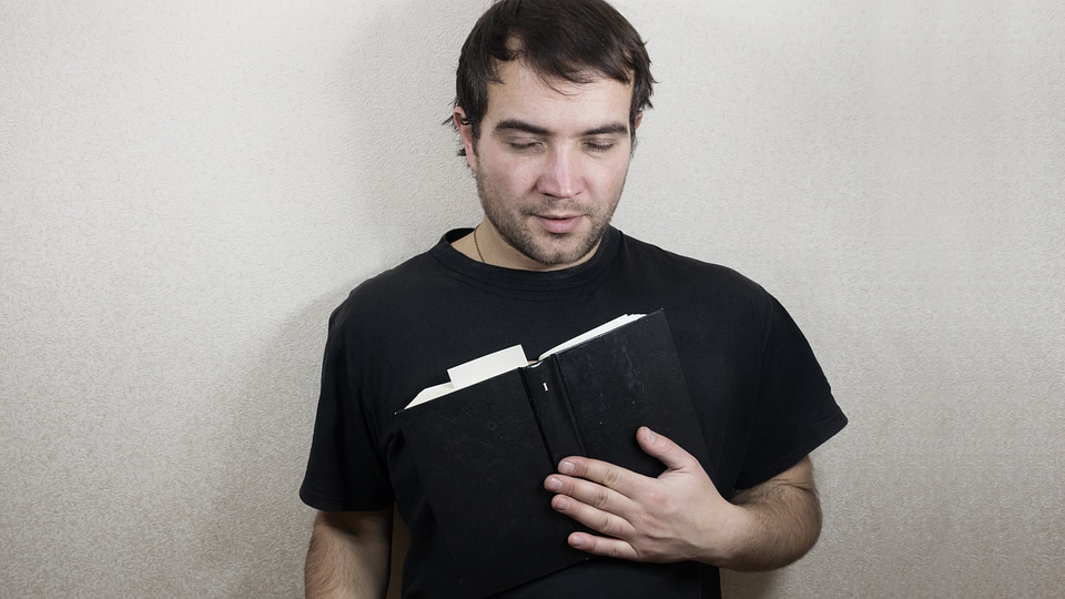 handsome young man reading