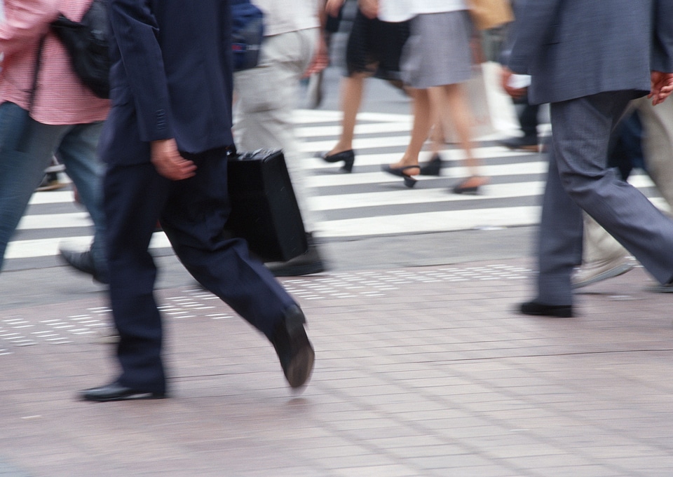 Unidentified businessmen crossing the street