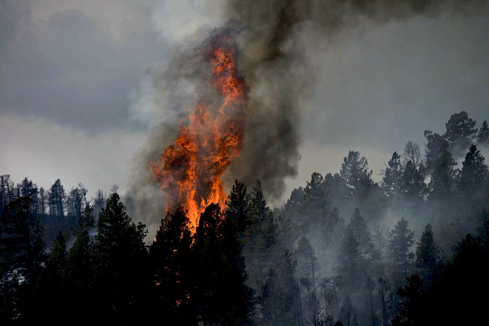 Wildfire smoke rises from burning mountains in Colorado