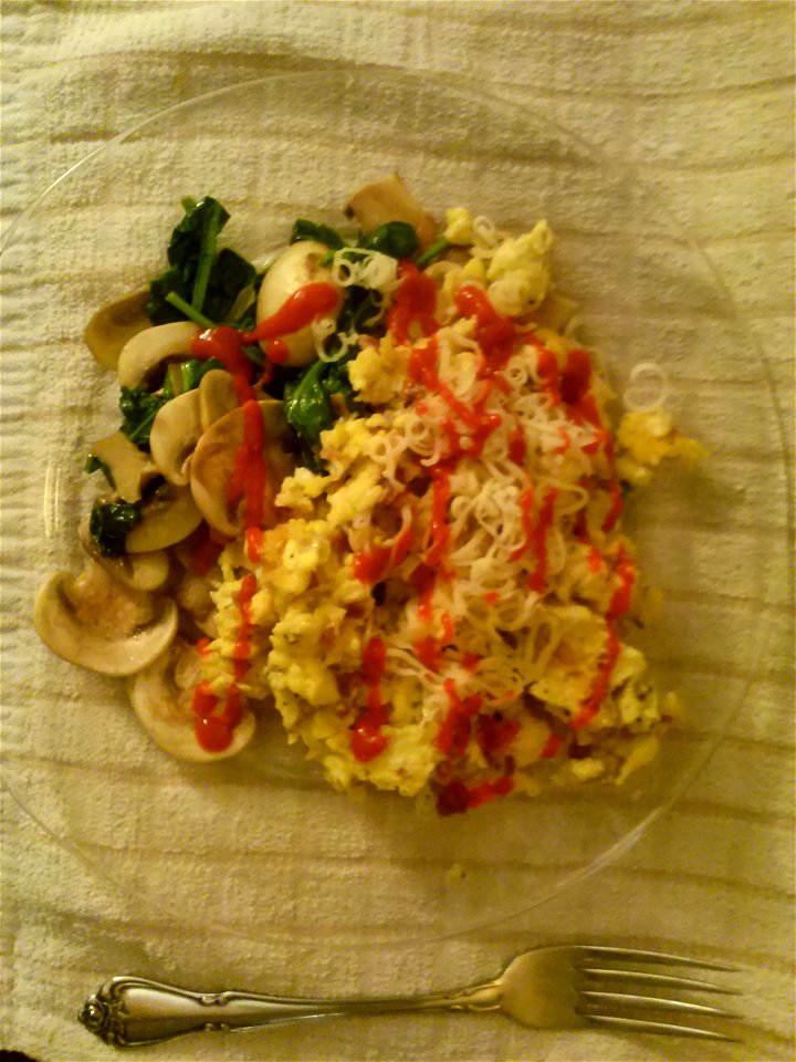 Eggs with cheese, mushrooms, and basil