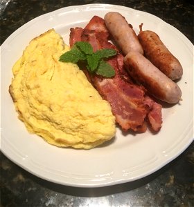 English breakfast South African style with egg, sausages and ham
