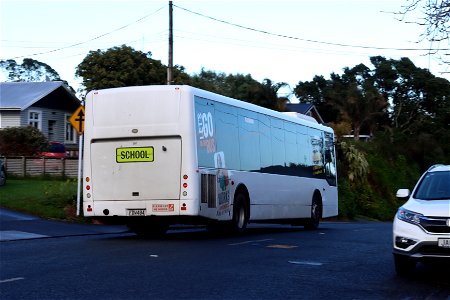 Back and side of school bus driving away, Ngāmotu New Plymouth, Taranaki, New Zealand