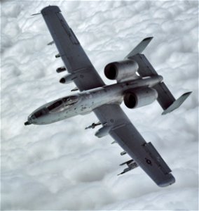 A-10 Thunderbolt II dives to low level close air support mission photo