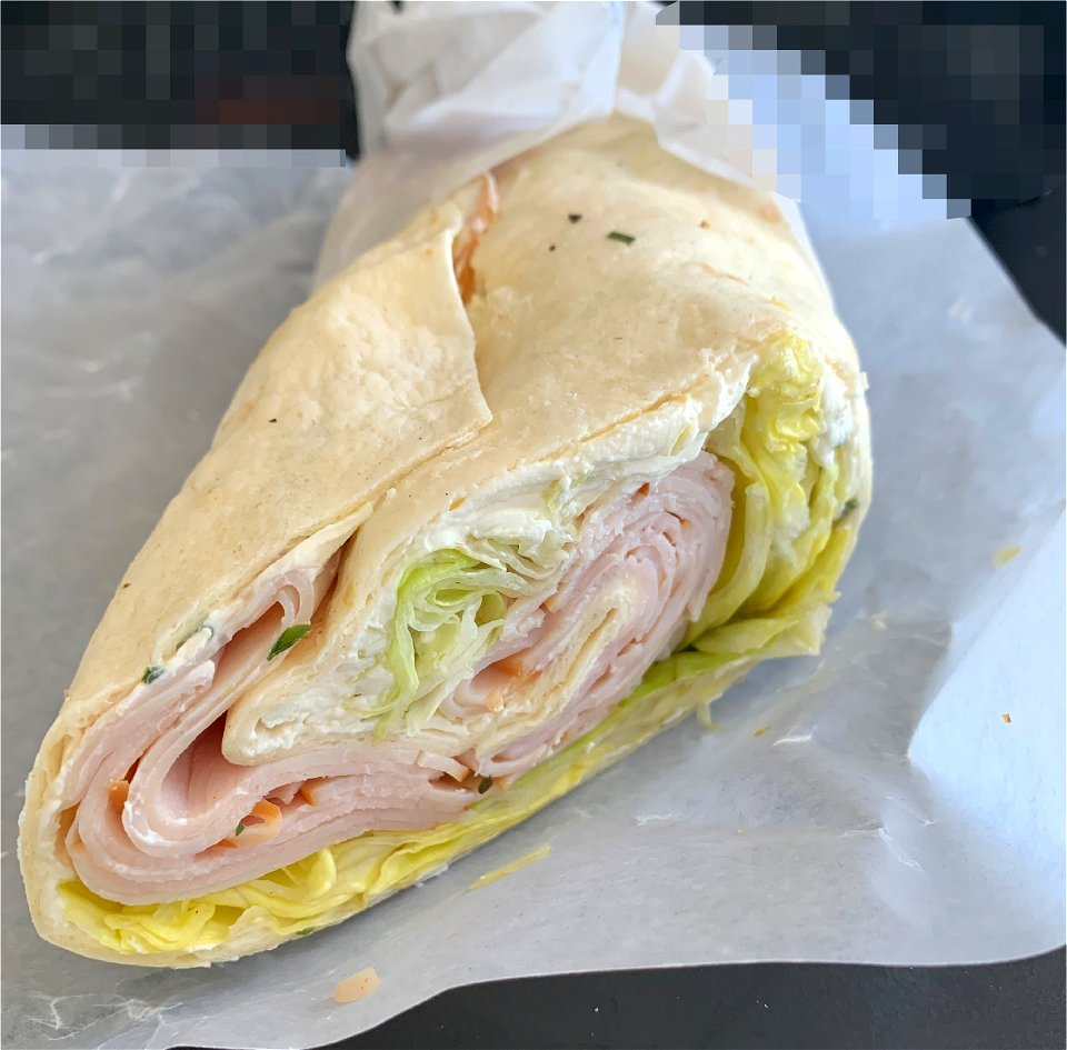 wrap with ham, salad, green and fresh cheese