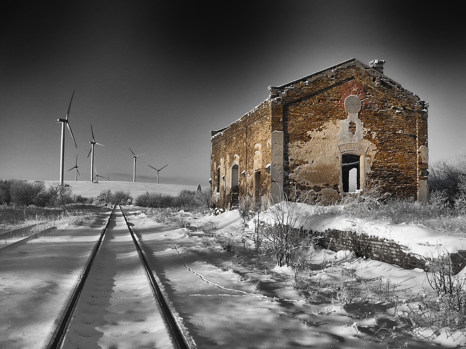 winter old building in a snowy landscape with distant