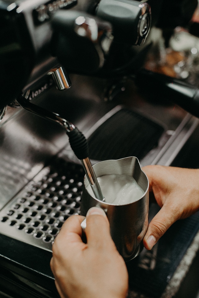 Close-up view of bartender preparing coffee