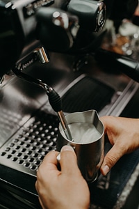 Close-up view of bartender preparing coffee