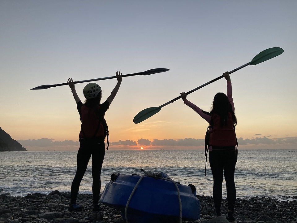 Women kayaking in beautiful landscape
