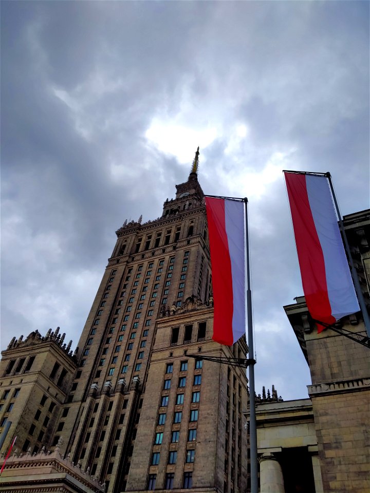 Poland flag with the Palace of Culture in Warsaw