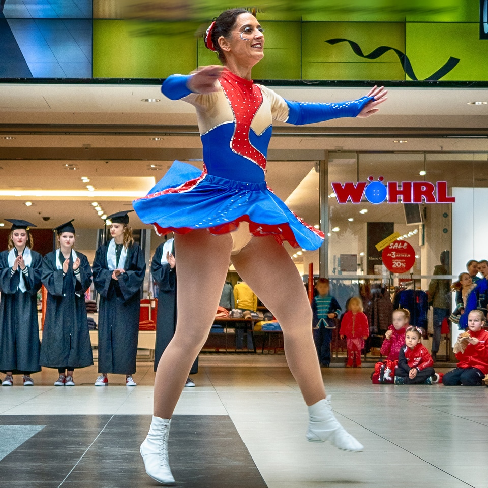 Cheerleader and dancer performing on stage