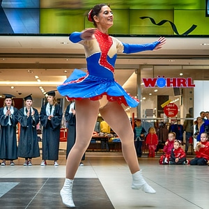 Cheerleader and dancer performing on stage