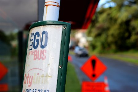 Close-up of bus stop information panel and hazard sign, Ngāmotu New Plymouth, Taranaki, New Zealand photo