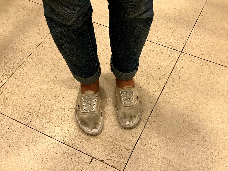 Well worn white vans