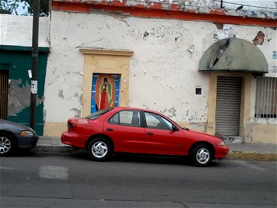 Pintura de la Virgen de Guadalupe en la calle photo